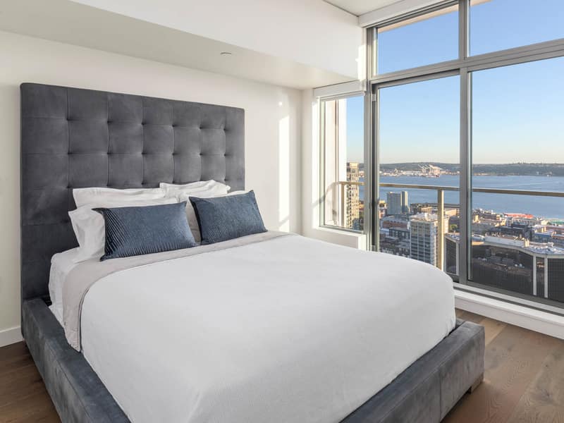 Staged bedroom with a water outlook