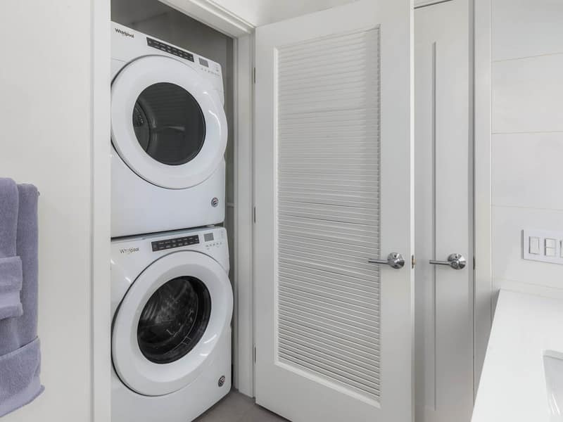 In-unit stacked washer and dryer in a closet